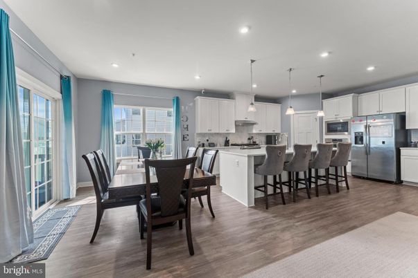 Dining room, Interior, Kitchen, Pendant Lights, Recessed Lighting, Stainless Steel Appliances, Wood Texture Flooring