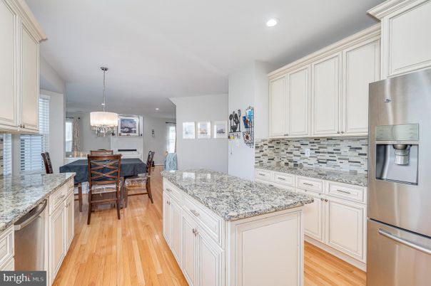 Chandelier, Dining room, Interior, Kitchen, Pendant Lights, Recessed Lighting, Stainless Steel Appliances, Wood Texture Flooring