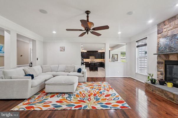 Fireplace, Interior, Kitchen, Living room, Recessed Lighting, Stone Walls, Wood Texture Flooring