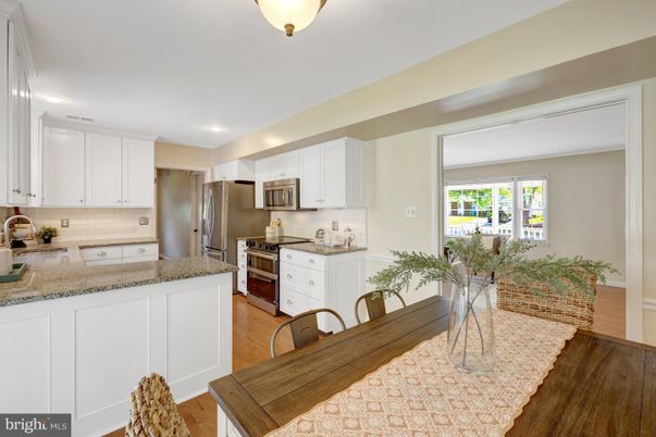 Dining room, Interior, Kitchen, Recessed Lighting, Stainless Steel Appliances, Wood Texture Flooring