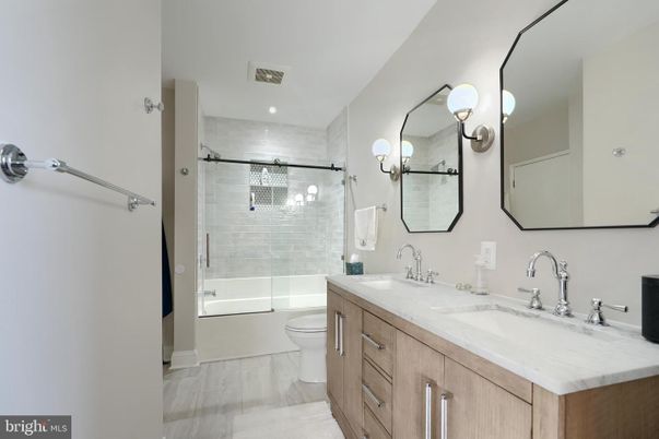 Bathroom, Dual Sink Vanities, Glass Shower, Interior, Recessed Lighting, Wood Texture Flooring