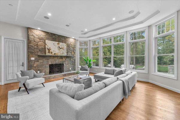 Fireplace, Interior, Living room, Recessed Lighting, Stone Walls, Wood Texture Flooring