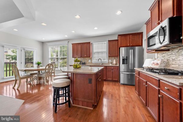 Dining room, Interior, Kitchen, Recessed Lighting, Stainless Steel Appliances, Wood Texture Flooring