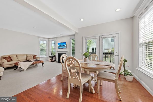Dining room, Fireplace, Interior, Living room, Recessed Lighting, Wood Texture Flooring