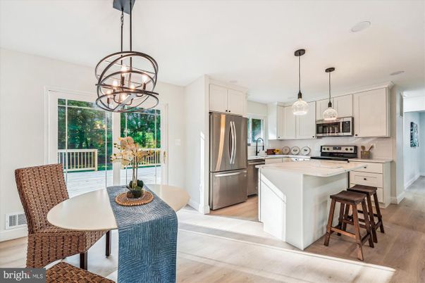 Chandelier, Dining room, Interior, Kitchen, Pendant Lights, Stainless Steel Appliances, Wood Texture Flooring