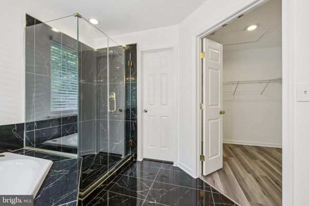 Bathroom, Glass Shower, Interior, Marble, Marble Walls, Recessed Lighting, Walk-in Closets, Wood Texture Flooring