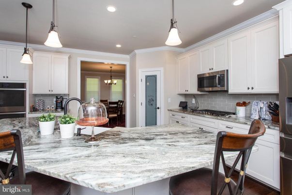 Chandelier, Interior, Kitchen, Pendant Lights, Recessed Lighting, Stainless Steel Appliances, Wood Texture Flooring