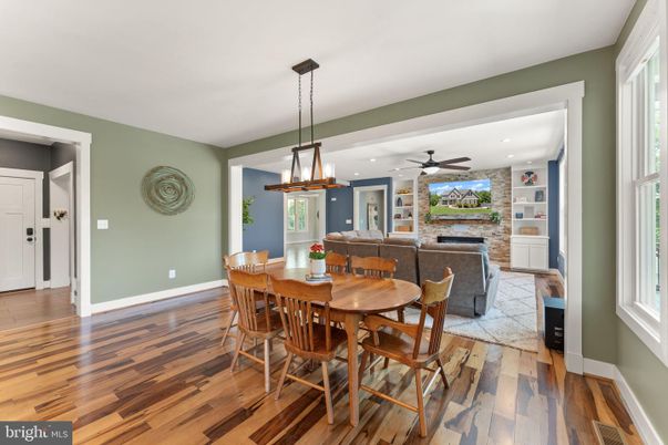 Dining room, Fireplace, Interior, Living room, Pendant Lights, Recessed Lighting, Stone Walls, Wood Texture Flooring
