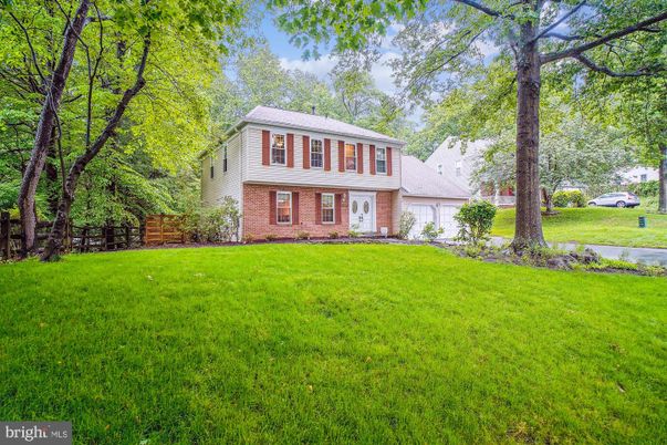 Attached, Backyard, Exterior, Facade, Brick Facade, Raised Ranch