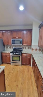 Interior, Kitchen, Recessed Lighting, Tile Countertops, Wood Texture Flooring