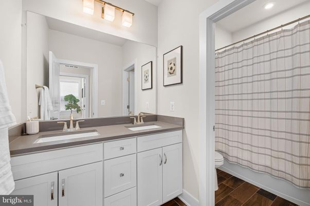 Bathroom, Dual Sink Vanities, Interior, Recessed Lighting, Wood Texture Flooring