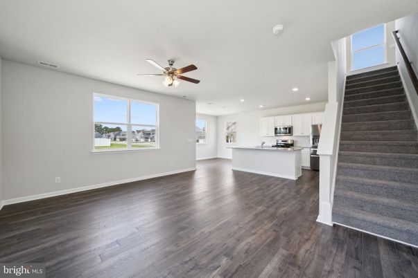 Empty room, Interior, Kitchen, Recessed Lighting, Stainless Steel Appliances, Wood Texture Flooring