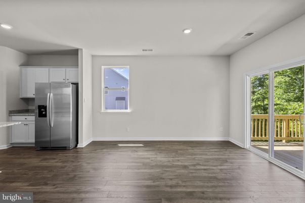 Empty room, Interior, Kitchen, Recessed Lighting, Stainless Steel Appliances, Wood Texture Flooring