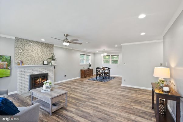 Dining room, Fireplace, Interior, Living room, Pendant Lights, Recessed Lighting, Stone Walls, Wood Texture Flooring