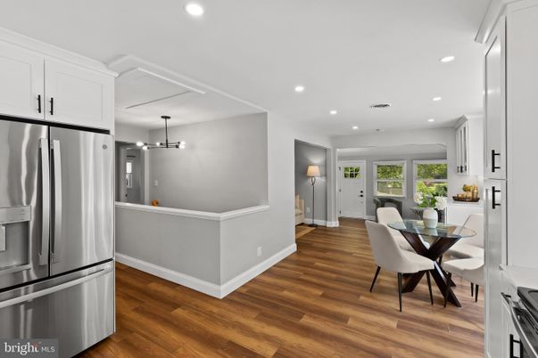 Dining room, Interior, Kitchen, Pendant Lights, Recessed Lighting, Stainless Steel Appliances, Wood Texture Flooring