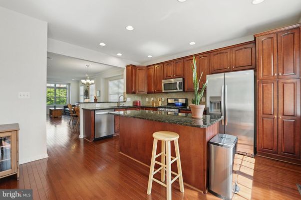 Chandelier, Dining room, Interior, Kitchen, Recessed Lighting, Stainless Steel Appliances, Wood Texture Flooring