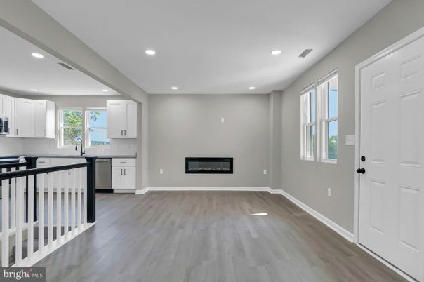 Empty room, Fireplace, Interior, Kitchen, Recessed Lighting, Wood Texture Flooring