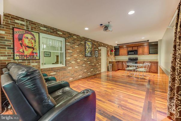 Interior, Kitchen, Living room, Recessed Lighting, Stainless Steel Appliances, Stone Walls, Wood Texture Flooring