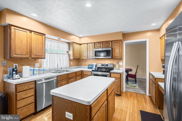 Dining room, Interior, Kitchen, Recessed Lighting, Stainless Steel Appliances, Wood Texture Flooring