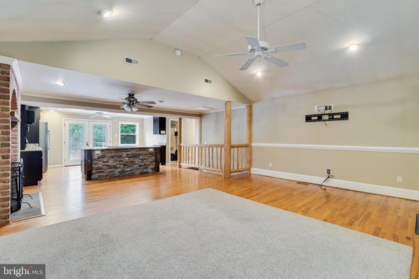 Empty room, Fireplace, Interior, Recessed Lighting, Stone Walls, Wood Texture Flooring