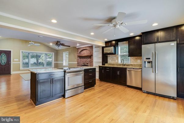 Interior, Kitchen, Recessed Lighting, Stainless Steel Appliances, Stone Walls, Wood Texture Flooring