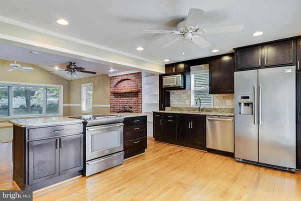 Interior, Kitchen, Recessed Lighting, Stainless Steel Appliances, Stone Walls, Wood Texture Flooring