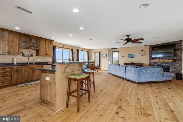 Fireplace, Interior, Kitchen, Living room, Recessed Lighting, Stone Walls, Wood Texture Flooring