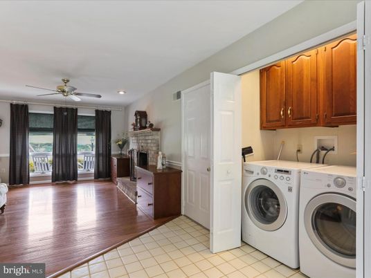 Fireplace, Interior, Recessed Lighting, Washer, Wood Texture Flooring