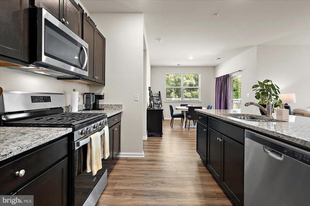 Dining room, Interior, Kitchen, Recessed Lighting, Stainless Steel Appliances, Wood Texture Flooring