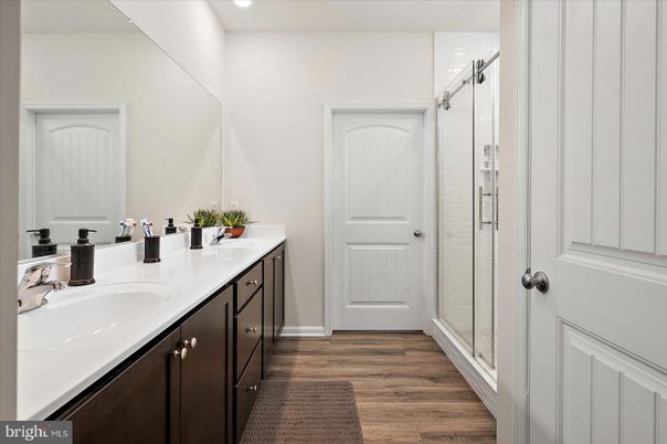 Bathroom, Dual Sink Vanities, Interior, Recessed Lighting, Wood Texture Flooring