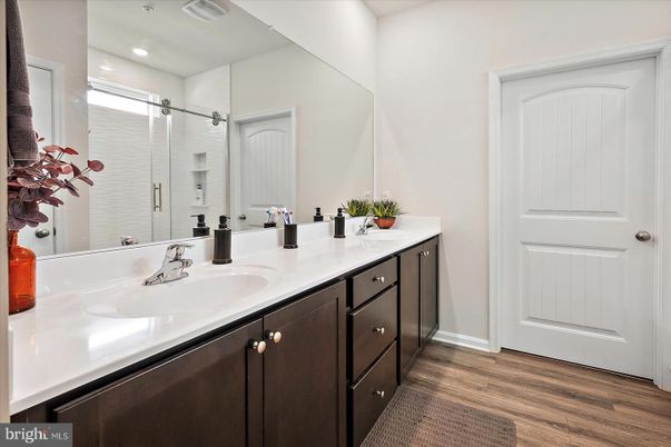 Bathroom, Dual Sink Vanities, Interior, Recessed Lighting, Wood Texture Flooring