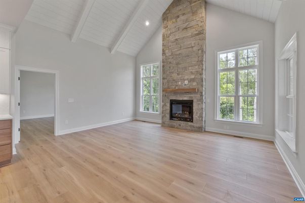 Empty room, Fireplace, Interior, Recessed Lighting, Stone Walls, Wood Texture Flooring