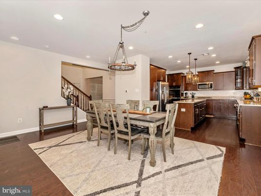 Chandelier, Dining room, Interior, Kitchen, Pendant Lights, Recessed Lighting, Stainless Steel Appliances, Wood Texture Flooring