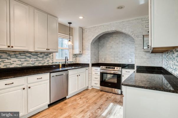 Interior, Kitchen, Pendant Lights, Recessed Lighting, Stainless Steel Appliances, Stone Walls, Wood Texture Flooring