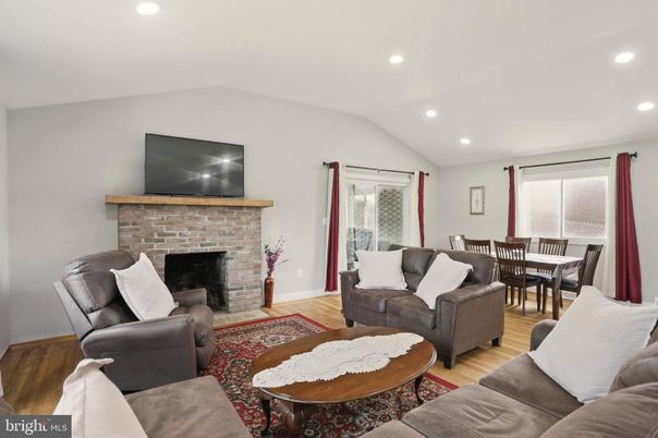 Dining room, Fireplace, Interior, Living room, Recessed Lighting, Wood Texture Flooring
