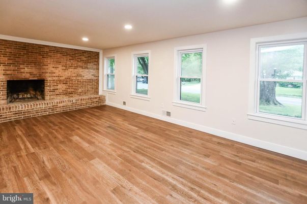 Empty room, Fireplace, Interior, Recessed Lighting, Stone Walls, Wood Texture Flooring