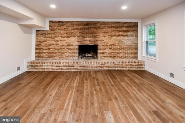 Empty room, Fireplace, Interior, Recessed Lighting, Stone Walls, Wood Texture Flooring