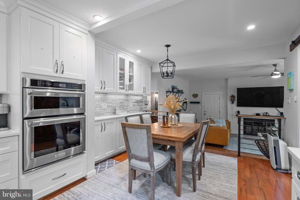 Dining room, Interior, Kitchen, Pendant Lights, Recessed Lighting, Stainless Steel Appliances, Wood Texture Flooring