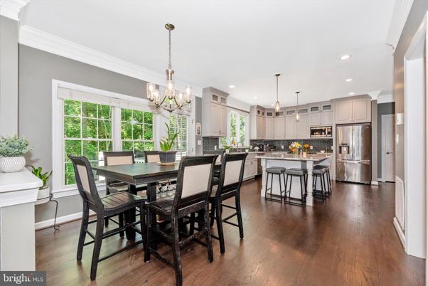 Chandelier, Dining room, Interior, Kitchen, Pendant Lights, Recessed Lighting, Stainless Steel Appliances, Wood Texture Flooring