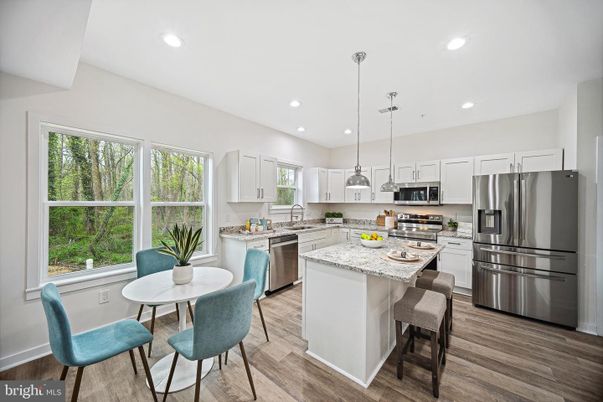 Dining room, Interior, Kitchen, Pendant Lights, Recessed Lighting, Stainless Steel Appliances, Wood Texture Flooring