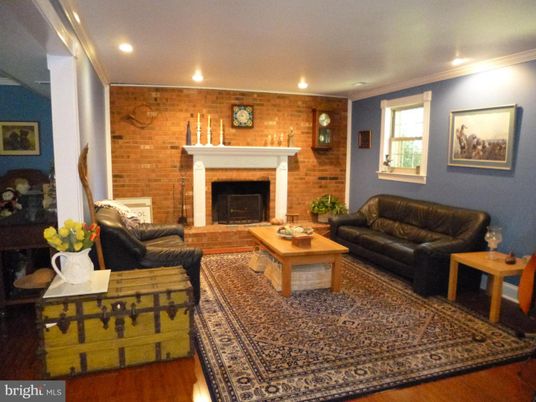 Fireplace, Interior, Living room, Recessed Lighting, Stone Walls, Wood Texture Flooring