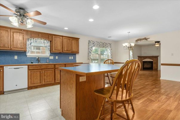 Chandelier, Dining room, Fireplace, Interior, Kitchen, Recessed Lighting, Wood Texture Flooring