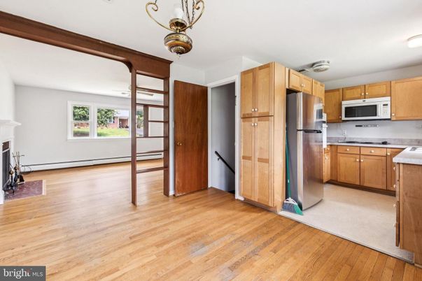 Fireplace, Interior, Kitchen, Stainless Steel Appliances, Wood Texture Flooring