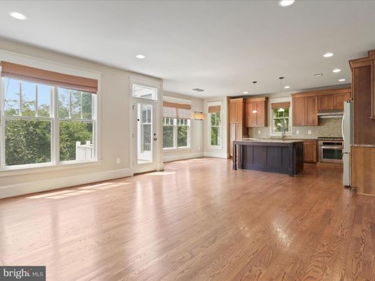 Empty room, Interior, Kitchen, Pendant Lights, Recessed Lighting, Stainless Steel Appliances, Wood Texture Flooring