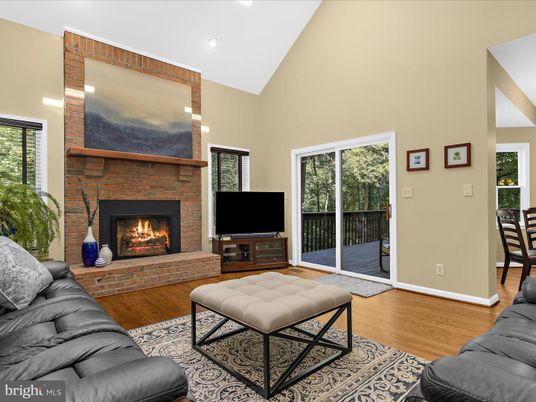 Fireplace, Interior, Living room, Recessed Lighting, Stone Walls, Wood Texture Flooring