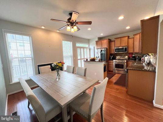 Dining room, Interior, Kitchen, Recessed Lighting, Stainless Steel Appliances, Wood Texture Flooring