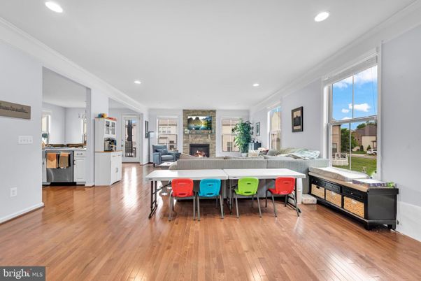 Dining room, Fireplace, Interior, Living room, Recessed Lighting, Wood Texture Flooring