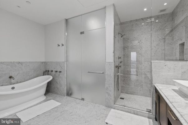 Bathroom, Free Standing Baths, Glass Shower, Interior, Marble, Marble Walls, Recessed Lighting