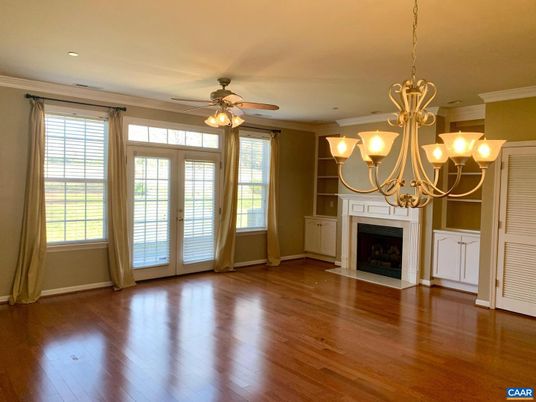 Chandelier, Empty room, Fireplace, Interior, Recessed Lighting, Wood Texture Flooring