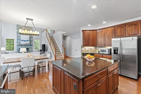 Chandelier, Dining room, Interior, Kitchen, Recessed Lighting, Stainless Steel Appliances, Wood Texture Flooring